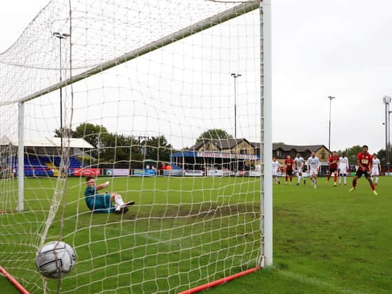 Decarrey Sheriff scores from the penalty spot to secure Kettering Town's 2-0 win over Chelmsford City. Pictures by Peter Short