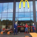 Glyn Pashley, "Spider-Man" Brett Owen and Cllr John Currall at the opening of the new McDonald's.