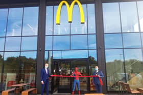 Glyn Pashley, "Spider-Man" Brett Owen and Cllr John Currall at the opening of the new McDonald's.
