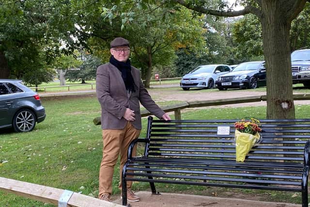 Cllr David Sims with the new bench