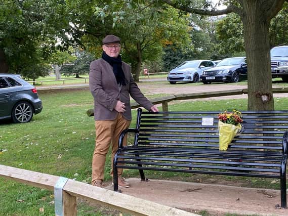 Cllr David Sims with the new bench