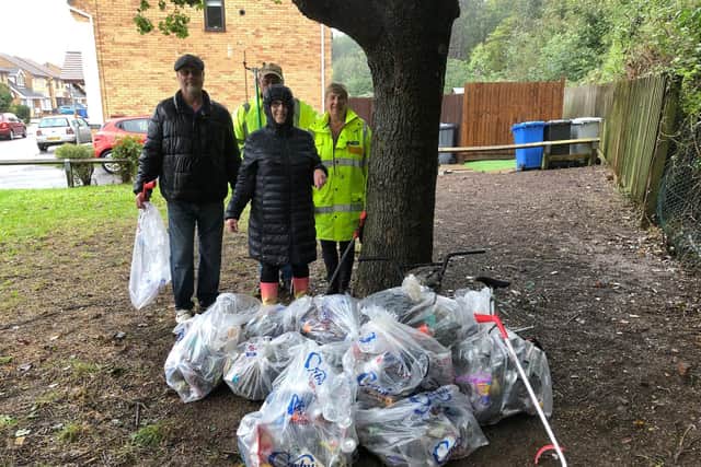 Kevin and Lesley Thurland and Greg and Josie Titcombe, along with some of the collected litter.