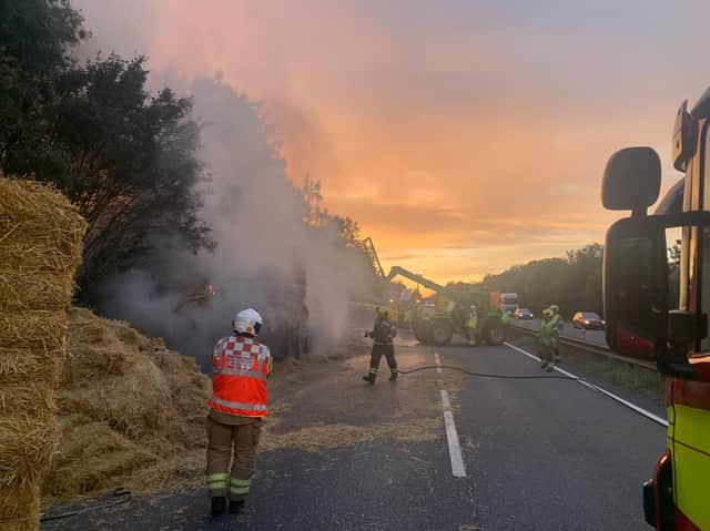 Firefighters battle the burning hay bales on the A14 in Northamptonshire last night. Photos: Northamptonshire Police