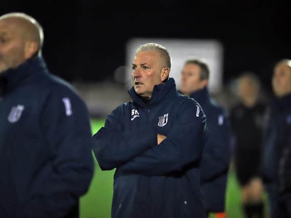 Gary Mills watches on from the sidelines during Corby Town's 2-0 defeat at AFC Dunstable last night. Pictures by Peter Short