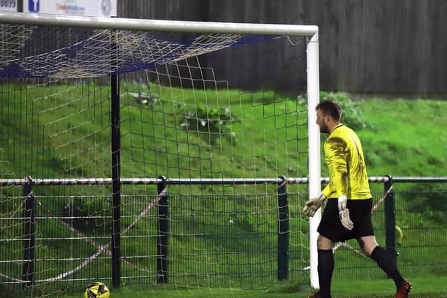 Craig Hill has to pick the ball out of the net after one of Dunstable's goals