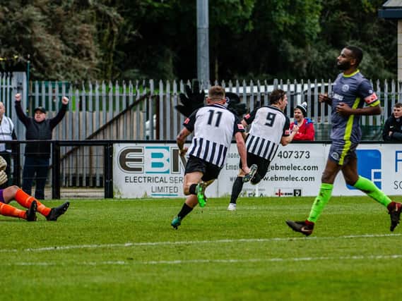 Tommy Yorston heads off to celebrate after he scored the only goal of the game on his Corby Town debut to give them a 1-0 victory over Halesowen Town in the second qualifying round of the FA Trophy. Pictures by Jim Darrah