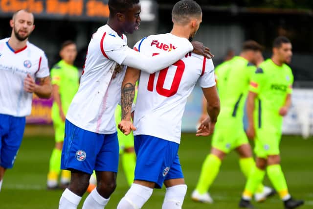 Lorrell Smith is congratulated after he opened the scoring from the penalty spot