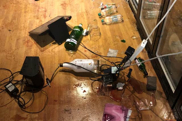 Some bottles of alcohol were taken and others were smashed up.