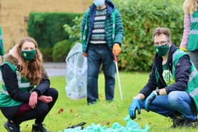 Emily Fedorowycz and Dez Dell with the dog poo they cleared.