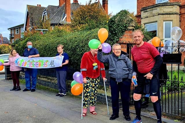 Chris with colleagues and supported individuals at Perrywood House, Kettering