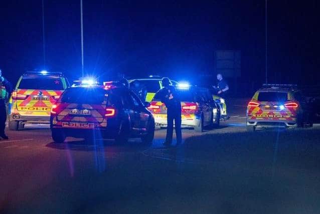 Officers take a 40-year-old man into custody in Corby. Picture courtesy of JCM.