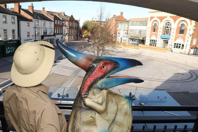 The pterodactyl looks out over the Market Place.