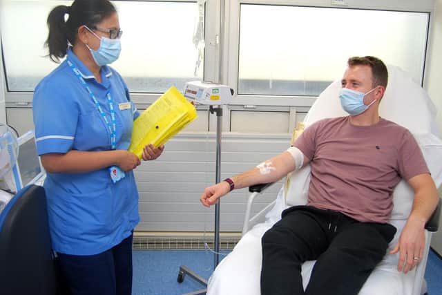 Staff Nurse Cy De Guzman with patient Callum Smithson in the newly expanded SDEC at KGH