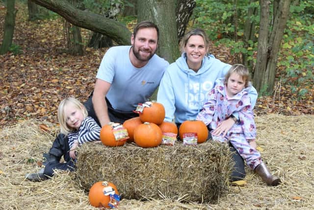 Paul Warren and Lisa Percival from Paws Dog Training with their children Hunter, five, and Pandora, three, at the pumpkin patch in Ise Lodge