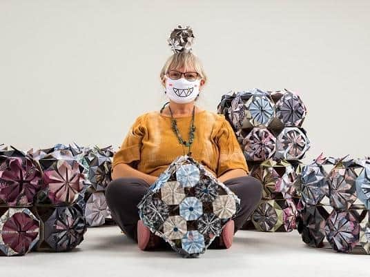 Artist Phiona Richards with origami kusudamas made as part of Time To... 
©Paul Stringer