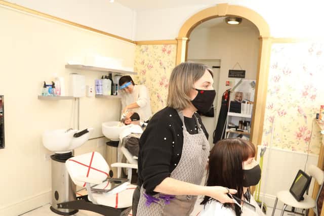 Clare finishes client Joan Smith's hair