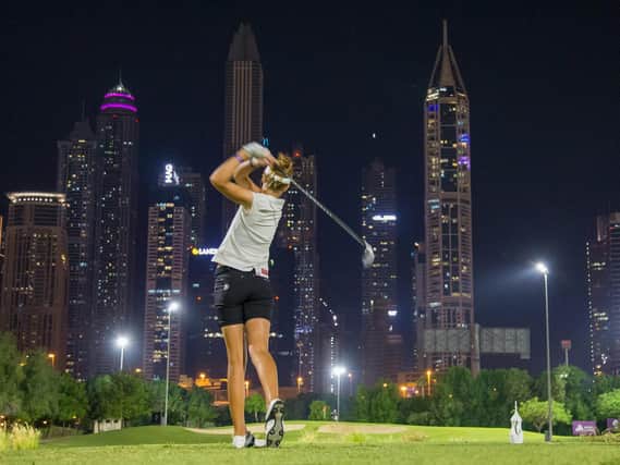 This incredible image shows Wellingborough's Meghan MacLaren in action during the Omega Dubai Moonlight Classic at Emirates GC. Picture courtesy of Ladies European Tour (LET)