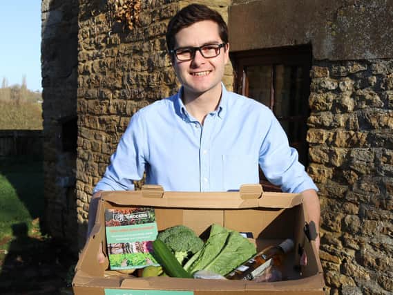 Founder of the company, David Bletsoe-Brown, with a box of fresh produce.