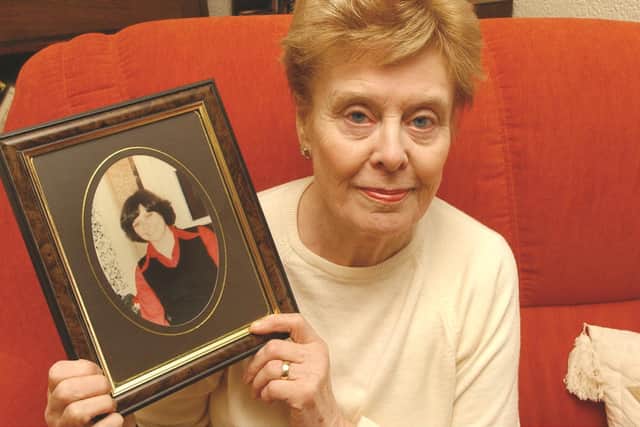 Beryl Leach, holding a photograph of her daughter Barbara, pictured in 2004.