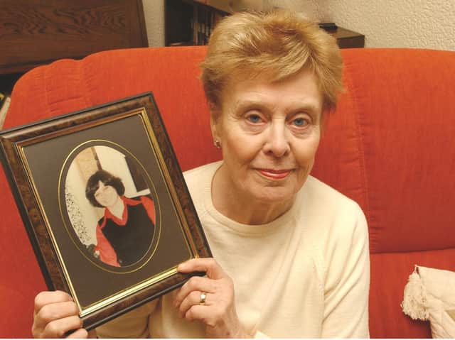 Beryl Leach, holding a photograph of her daughter Barbara, pictured in 2004.