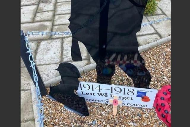 Northamptonshire Police have arrested a man, 24, in connection with the vandalism of a war memorial in Thrapston.