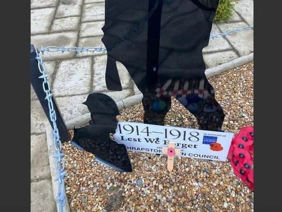 Northamptonshire Police have arrested a man, 24, in connection with the vandalism of a war memorial in Thrapston.