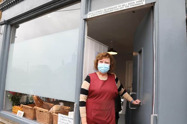 Julie Powell outside the shop