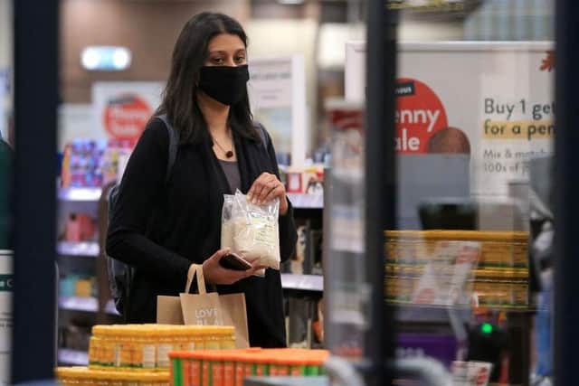 Laws requiring shoppers to wear face coverings came into force in July. Photo: Getty Images