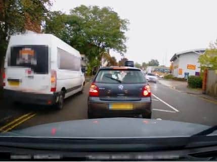 One driver's dashcam showed a van driving down the footpath to beat queues