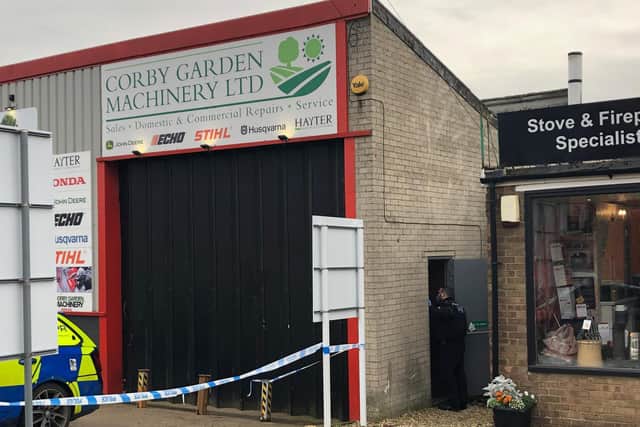 Police are still on the scene after the owner found the mans body at 7.30am today
