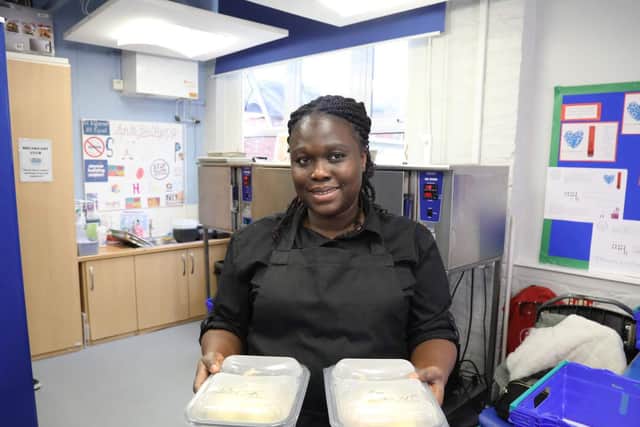 Emelia Osei-Bonsu kitchen staff serving hot meals for the children