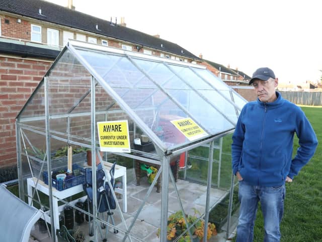 Kettering Council officers have slapped two 'under investigation' stickers on the greenhouse.