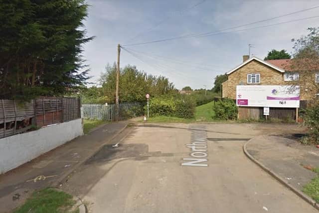 Northamptonshire Police are appealing for witnesses after a woman was attacked by a dog in the alleyway on Northwood Road in Northampton.