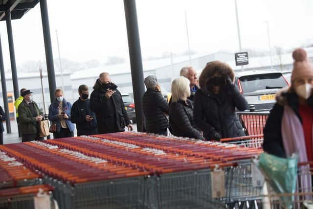 Customers queued up following the grand opening of the new Sainsbury's store in Brackley, Northamptonshire.