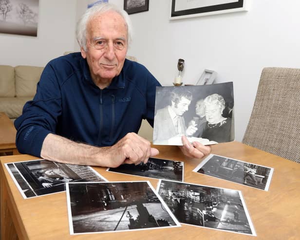 John Allen with photos from his time in TV