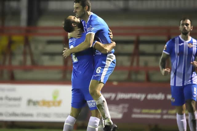 Luke Graham gets a lift from Gary Stohrer after the Kettering Town captain scored his team's first goal in their 2-0 victory at Kidderminster Harriers. Pictures by Peter Short