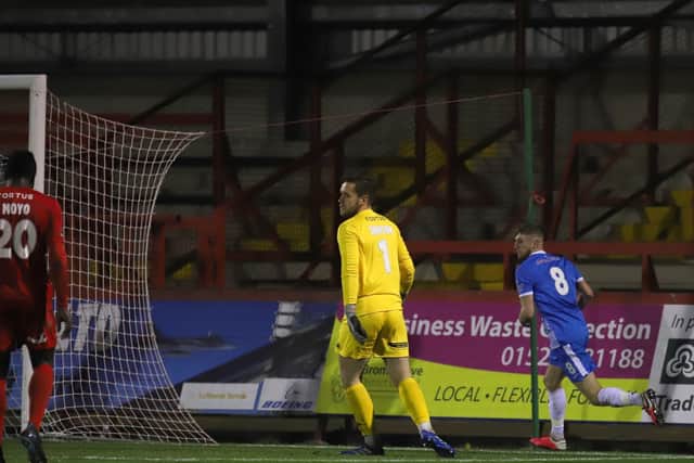 Connor Kennedy heads off to celebrate after he scored Kettering Town's second goal in their 2-0 success at Kidderminster Harriers on Tuesday night. Picture by Peter Short