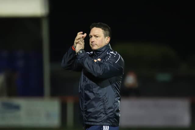 Paul Cox applauds the supporters after the final whistle