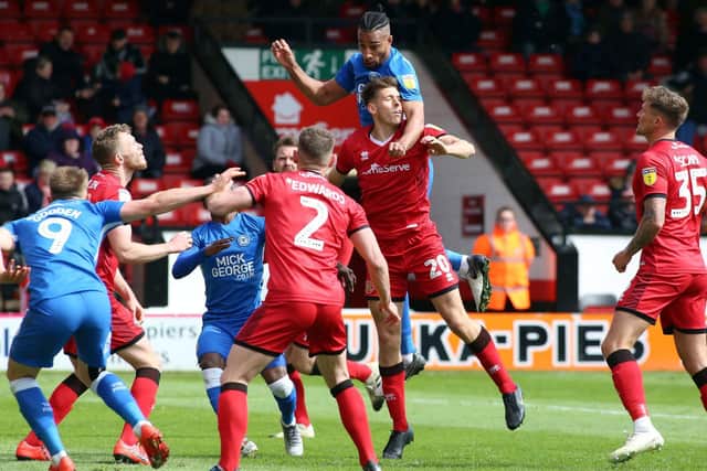Connor Johnson (No.20 in the red colours), pictured during his time at Walsall, has signed for Kettering Town