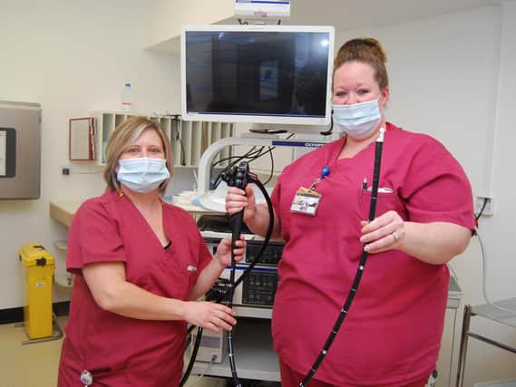 Endoscopy Unit staff members Lucy Drage and Steph Touray with some of the new endoscopy equipment.