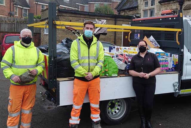Workers from contractor Carnell, Eamonn Bailey (left) and Liam Allen, drop off supplies to Sue Walsh at Rushden food bank