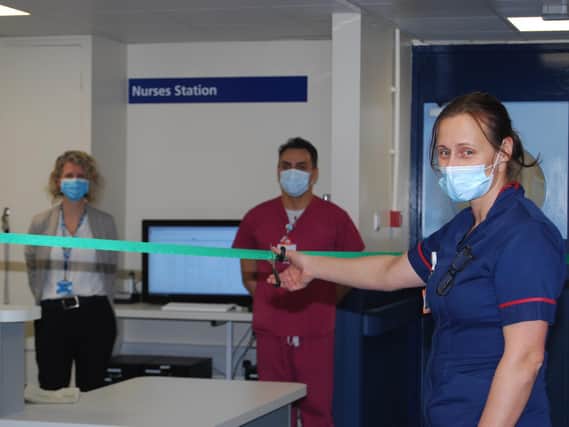 Matron for Urgent Care Wards Louise Hyde, pictured cutting the
ribbon to re-open the MAU.