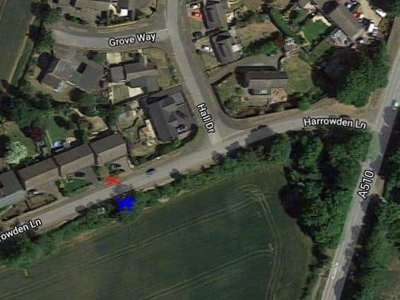 The red cross marks the position on the grass verge of the hole. 
The blue cross show the entrance to the disused tunnel