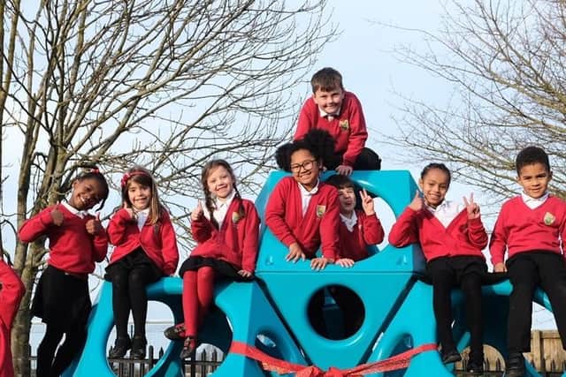 Children on the new play equipment.