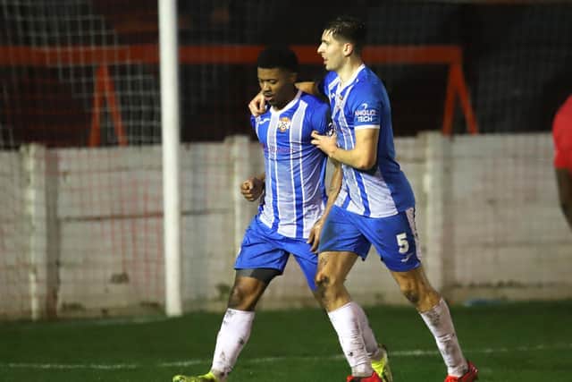 Decarrey Sheriff celebrates his goal with Connor Johnson during Kettering Town's 2-1 success at Ashton United in the third round of the FA Trophy on Saturday. Picture by Peter Short