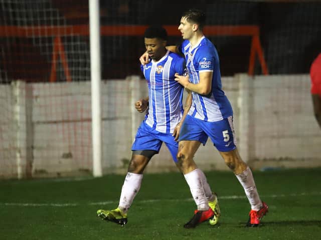Decarrey Sheriff celebrates his goal with Connor Johnson during Kettering Town's 2-1 success at Ashton United in the third round of the FA Trophy on Saturday. Picture by Peter Short