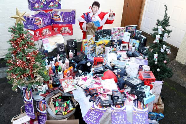 Jeanette - Mother Christmas - with some of the gifts bought with the money raised by the online appeal