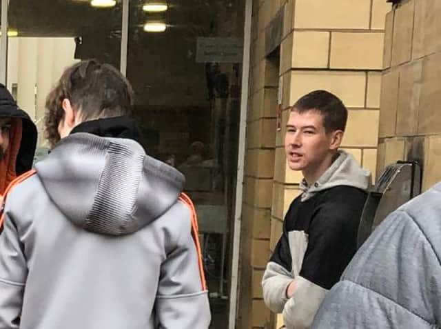 Jamie Welch (facing away from the camera) and Luke Welch outside court today