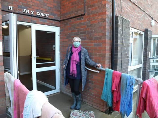Brigstock Parish Council chairman Sally Wilks outside Harpers Court today (Thursday)