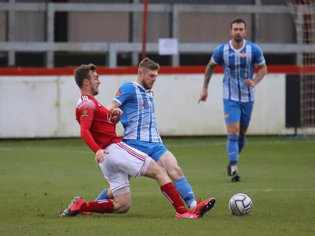 Kettering Town's Connor Kennedy and Brackley Town's Shane Byrne battle for possession during the 1-1 draw between the two clubs at St James Park. Pictures by Peter Short